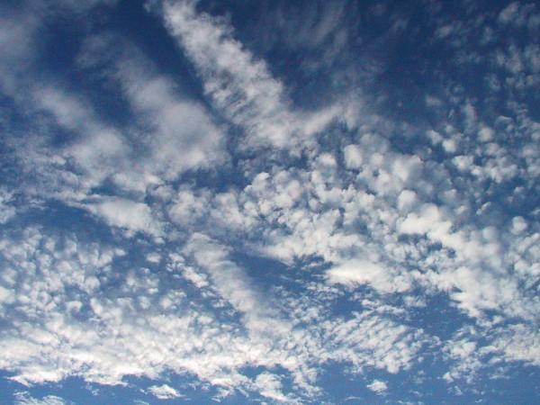 An interesting formation of clouds settles in for the afternoon in front of an otherwise blue sky.